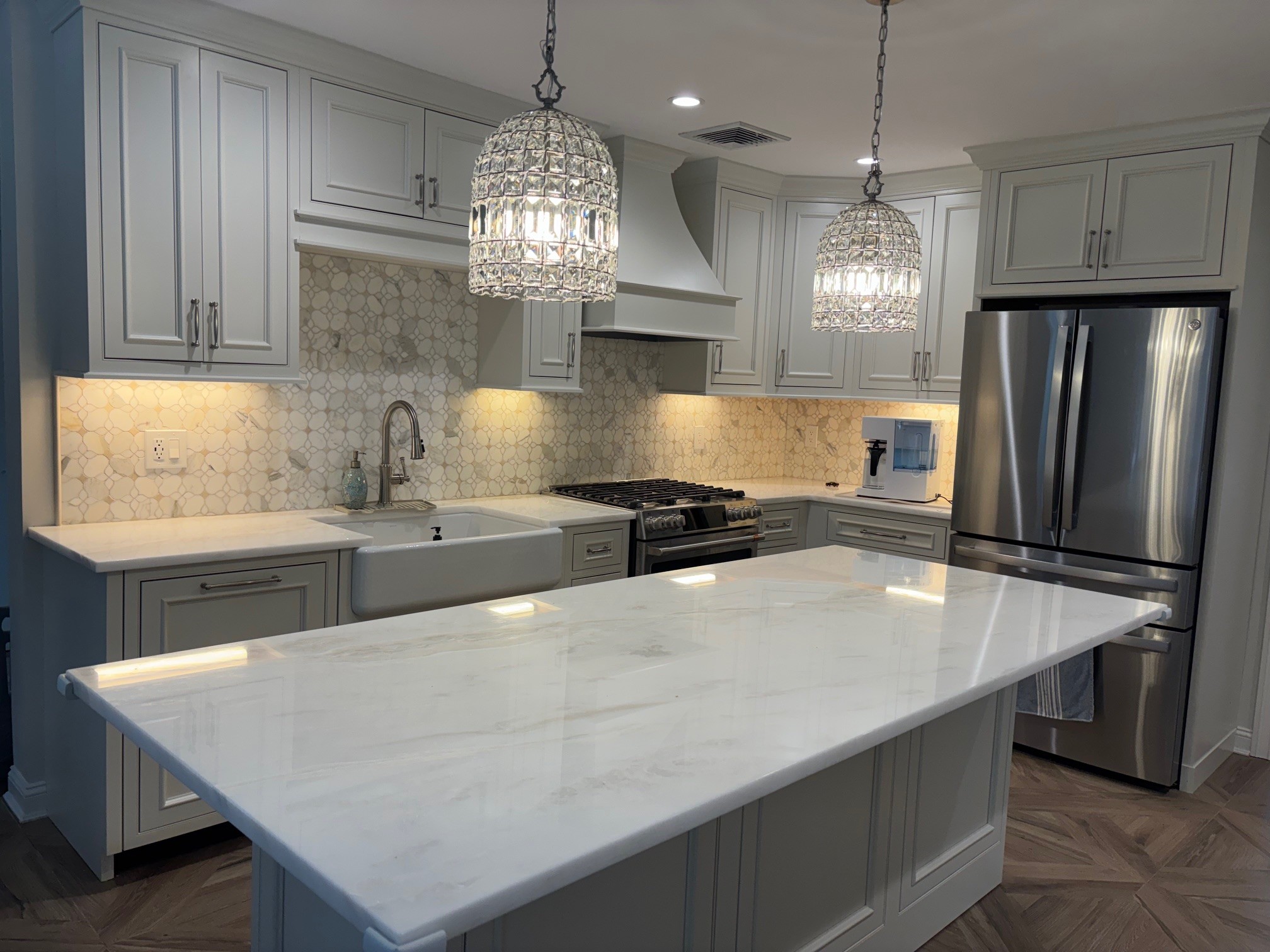 Inset kitchen cabinetry with painted island